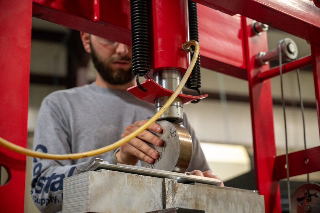 Machinist examining a sheet metal part
