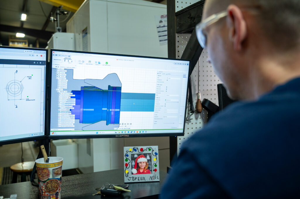 Technologies: Engineer examining 3D CAD file in Louisiana manufacturing shop