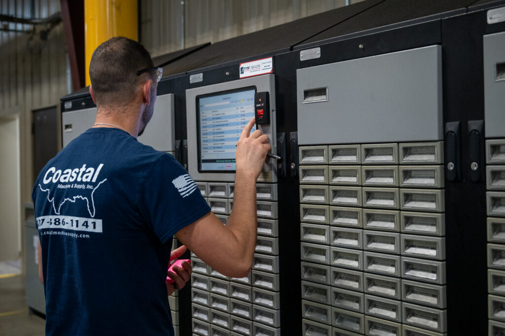 CNC Operator beginning operation on cnc machine
