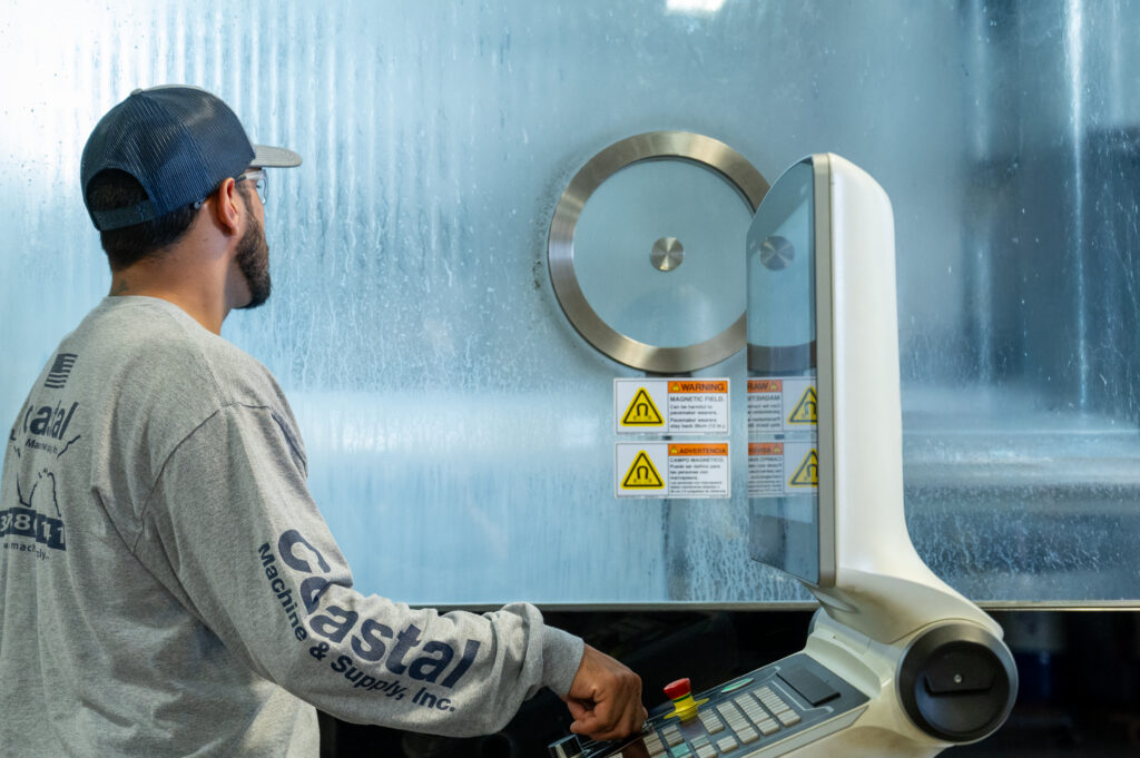 Coastal CNC operator manufacturing large sheet metal parts