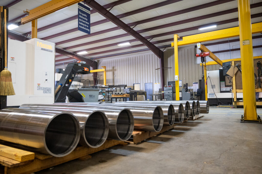 Large machined parts ready for packaging and shipment at a Louisiana manufacturing facility