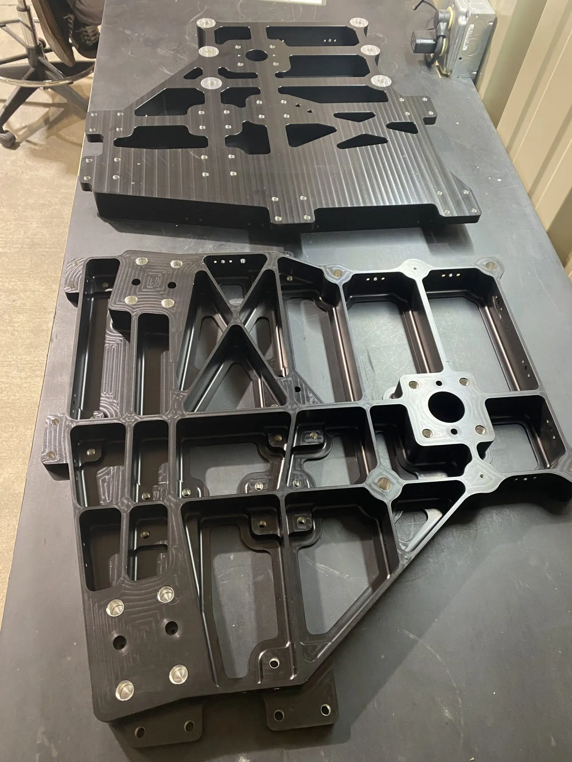 Aluminum Rocket Brackets finished with Chemical Conversion and Hard Black Anodize