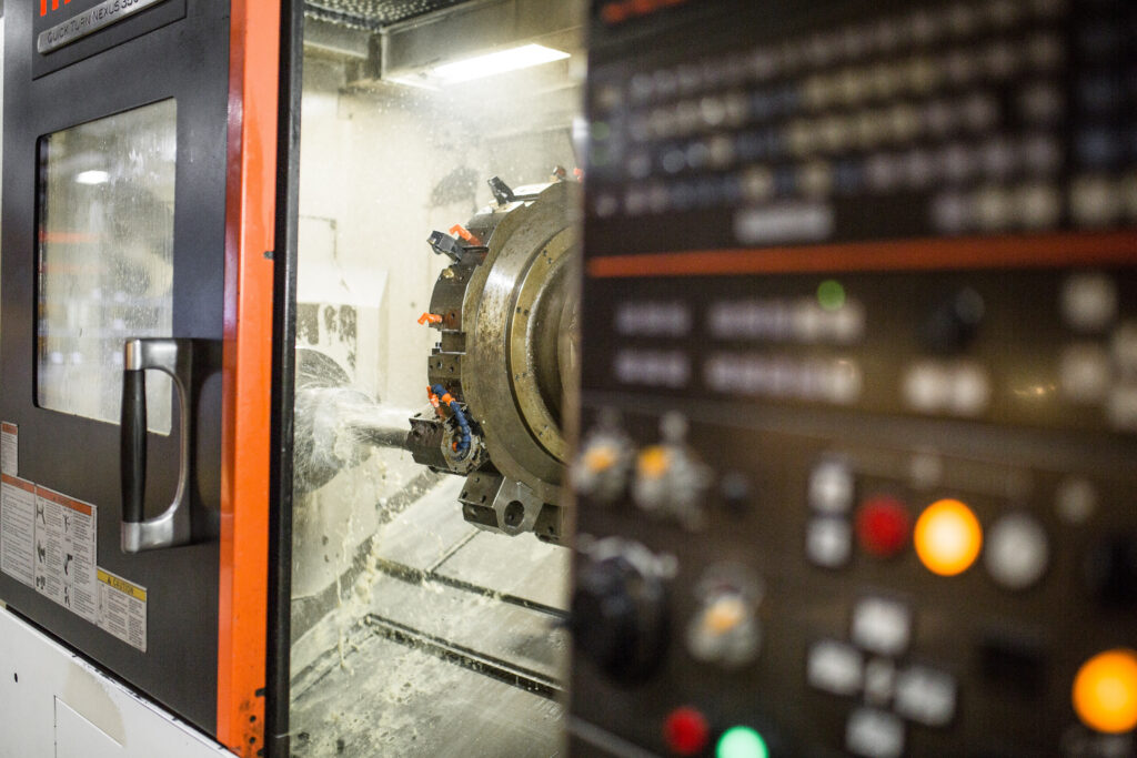 cnc turning machine undergoing operations on sheet metal part