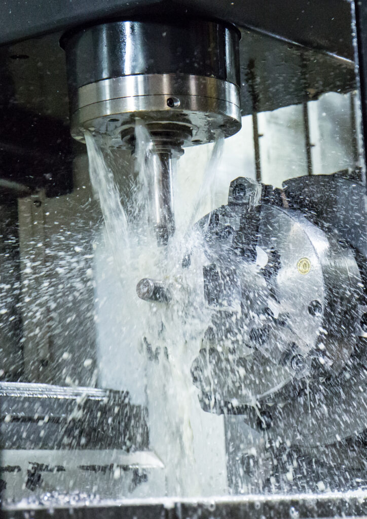 5-axis mill operating on sheet metal parts