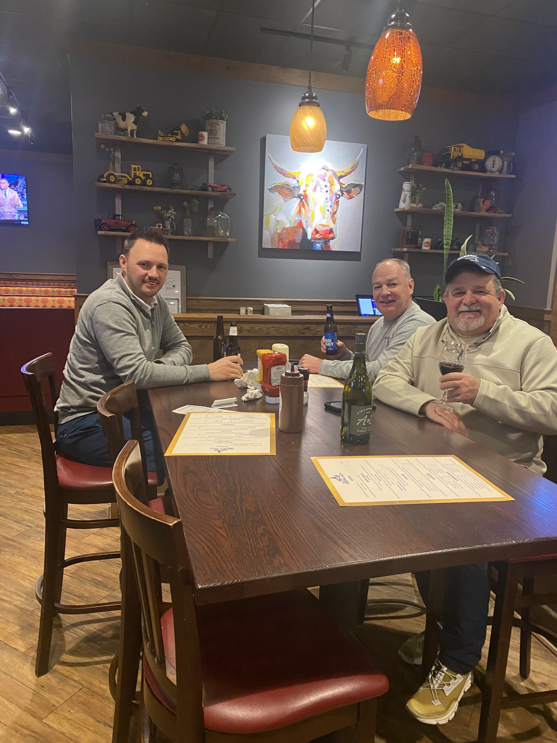 Coastal Machine & Supply employees attending fantasy football draft party